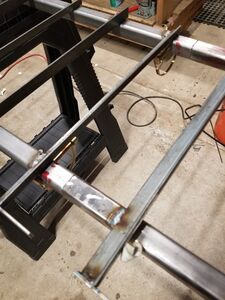 Tie stops welded to support beams.