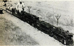 Double heading, Mann uses both locomotives to pull extra long trainload of youngsters and adults.