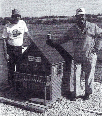 Don Isom of Klamath Falls, Oregon (left), builder of many of the miniature structures on the railroad, with David Hannah at The Browning Railroad town of Isomville.