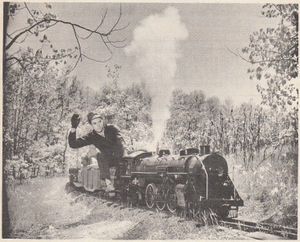 David Booth at the throttle of No. 147, the coal burning 4-6-2 Pacific steam loco of the Tipsico Lakeshore Railroad which is located 6 miles south of Fenton, Michigan and 50 miles northwest of Detroit. This small railroad is a 7-1/4 inch gauge line built to the scale of 1-1/2 inch to the foot. Photo by the Detroit News.