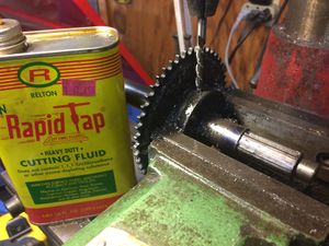 Reaming a tapered hole after drilling. Rapid Tap works well to keep the reamer cool. Pull the reamer out frequently to extract chips, then apply more cutting fluid.