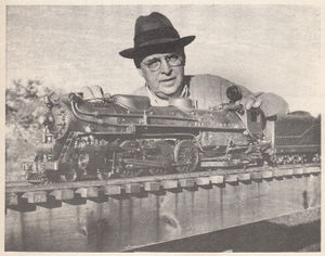 Charles Hadfield, of New Britain, Conn., with his 1/2 inch scale 2-1/2 inch gauge Pacific. This engine has a working feedwater heater (seen on top of smokebox) and is equipped with a Shattock design vaporizing alcohol burner. A single cylinder steampump under the cab deck and a tender hand-pump take care of the water supply to the boiler. Some five years of spare time and more has gone into building the engine & tender and its passenger carrying flatcar and backyard length of track. It shows a craftsman's love of this fine steam hobby (helped along somewhat by friend Hadfield's Toolmaking experience). From "The Live Steamer", Mar-Apr 1950