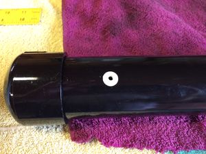 I started with the air tank. It is constructed using 2 inch diameter PVC pipe (schedule 40) with a pair of caps. A hole was drilled and tapped for 10-32 threads to accept a Clippard fitting. An adhesive dot was placed over the hole before painting.