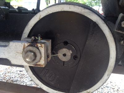 The rear driver is a ten pound cast iron exercise weight with a steel tire.