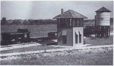 The newly constructed Isom Craft interlocking tower pictured here was constructed for the Browning Railroad by Mr. Don Isom of Klamath Falls, Oregon. Both the interlocking tower and the water tower were constructed in 2 inch scale to complement the 1-1/2 inch scale Live Steam railroad equipment. From Modeltec, October 1988.