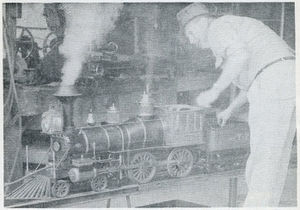 Durkee firing up his 1-1/2 inch scale Early American engine on the hydraulic lift. Photo by Harry Dixon, Summer 1957.