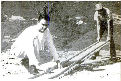 Club members help install 1.5 inch scale tracks at Seymour F. Johnson's mountaintop spread. Aluminum rails are held to redwood ties by miniature steel spikes.