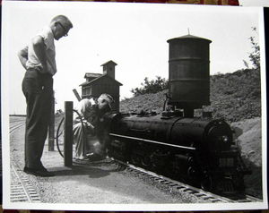 Linn H. Westcott watches Seymour Johnson work on his live-steam 4-8-4, Goleta Valley Western R.R., Montecito, California.