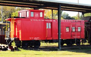 Columbus and Greenville Railway wooden caboose "The Bob Gray" on display in Columbus, Mississippi. Terry Shirley wrote: "Bob took me to that park for a look. He had keys to the enclosure, so we climbed up into the caboose. I have shots of him, and myself, in the side doorway, and the cupola. The city named the caboose for him for two reasons. First, this was his regularly assigned caboose when he worked for the C&G. Second, he was very instrumental in assisting in the move of the entire display train to this park. He was quite a guy."