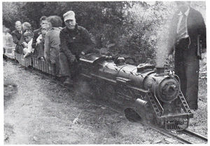 Horace Shaw at the throttle, Hugh Pettis stands behind the front of the locomotive. Photo by Cliff Pettis.