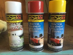 I found this "Van Sickle" brand of enamel spray paint at a farm and ranch store named "Atwoods" in Greenville, Texas. Only the red and white was used on the caboose; yellow vinyl was used for the large "Santa Fe" logo instead.