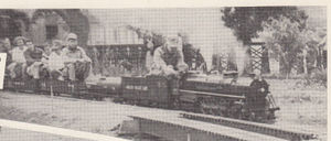 Seymour with train going by passing track. The second passenger is Clark Durkee and the fifth passenger is Marion Durkee, the son and wife of Dwight Durkee Jr.