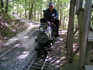 Harry Bean riding behind son Earl on Blue Ridge Summit Railroad, 2002.