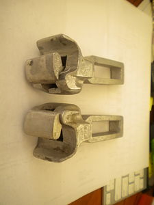 A pair of couplers manufactured by Karlson Model Products.