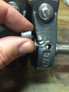 The Zerk fittings on the bearing block were protected by a plastic cap. The Zerk is unscrewed in order to remove the cap. Be sure to tighten the Zerk fitting back in place.