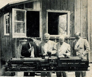 At Bob Day's home, left to right are Dave Rose, Les Friend, Dick Jackson and Bob Day. In the background is the Engine House. The locomotive is on the hydraulic hoist used to lift it from ground level to bench top in house. The hoist also serves as a turntable. From "The Miniature Locomotive", Nov-Dec 1952.