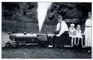 Calvert Holt with his wife and children, posing with his P.R.R. K4s Locomotive. "The Modelmaker", September 1932.