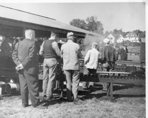 Carl Purinton and Harry Sait are the two gentlemen at the far right with their backs facing the camera. Lester Friend to left of Carl with back turned.