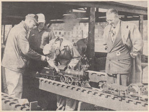 Roundhouse scene at the New England Live Steamers track at Danvers, Mass. at the 18th Annual BLS meet on October 6 to 8th, 1950. Tom Noonan, one of the visiting steam men, looks on as Bill Van Brocklin and Barney Barnfather lend George Murray a hand in preparing to steam up the Bergh 4-4-0, brought by George to the meet. From "The Live Steamer", Jan-Feb 1951.