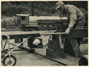 Showing how dolly lines up with track. The engine can now be rolled onto the main line.