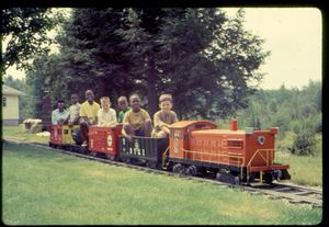 John D. Atkinson driving a train load of happy kids touring the Atkinson Railroad, 24 October 1968.