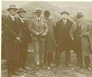 The photograph from Steel's The Miniature World of Henry Greenly, page 160, shows Greenly (second from left of picture) standing next to William Stanier (LMSR) with locomotive engineers at Dalegarth on the Ravenglass & Eskdale Railway.