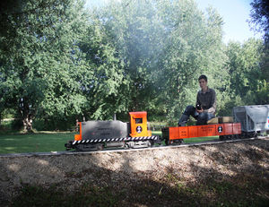 Ken Rodig - This is a new prototype of the famous SW1 switcher locomotive. Four gear case axle drives provide plenty of tractive motive power on this compact 1.5" scale electric powered locomotive. The 110 watt sound system provides the most realistic effects of an actual SW1 diesel locomotive. Road colors represent the "Ironwood System" which was noted for their longtime rail service to the paper industry.