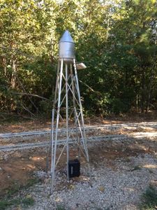 Shane Murphy posted on ‎Backyard Railroading: I built this water tower about a year ago for a friends 7.5" gauge RR. The water tank is an A/C freon tank, hat on top is a funnel, legs and bracing just fabricated from angle iron, "fill pipe" up the center is 1" conduit, railing is 3/16" rod with galvanized wire wrapped 360 deg around the platform. Just the other day, one of the guys that helps out attached the solar panel up top and a 12 VDC battery down low, and this now powers about 1/6 th of the signal system on the railroad.