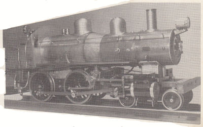 At this stage the boiler is erected along with the smokebox, stack, domes, running-boards, buffer beam, and headlight. Note boiler lagging brings up shape to wagon top type.