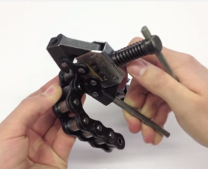 Use a Chain Breaker to remove the unwanted link. Refer to the video Splitting a Chain with a Chain Breaker
