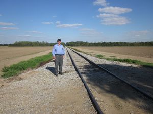 Bob Gray on the old Columbus & Greenville Railroad, from which he retired about 1973 after surviving a train wreck. He served as a consultant on the movie, "Oh Brother, Where Art Thou", which was released in 2000. Here is Bob standing alongside the track where the train scene was filmed at the beginning of the movie. Bob had actually been in the cab of the steam locomotive while the scene was shot. He has a photo of himself taken with George Clooney. Photo by Terry Shirley.