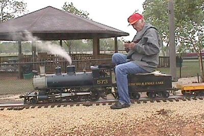 As he comes off the turntable lead, Jack Lucks does a radio check with the tower. October 2000 at the Houston Area Live Steamers.