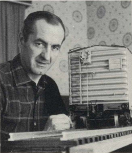 Builder J. Normand Martin demonstrates the fine detail typical of the entire train.