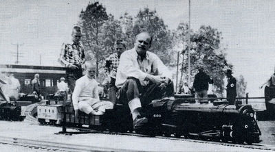 Bob Day and sons with 1 inch scale Great Western Lines train at Los Angeles Live Steamers Golden Spike ceremony, May 5, 1957.