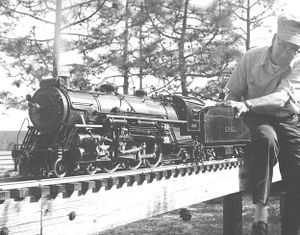 Frank Kayler running his 3-1/2 inch gauge Pacific for visitor Dan Watson. Track is at Frank's home in just outside Southern Pines, NC, 21 April 1974. Photo by Frank Kayler, used with permission.