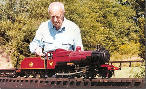 Carl Purinton with his freshly re-painted "Red Hen". Bob Hornsby repainted the entire locomotive, Carl had him restore the hen, but it was yellow gold in color. Carl also asked Bob to paint a coat of arms on the tender. It still remains that way today.
