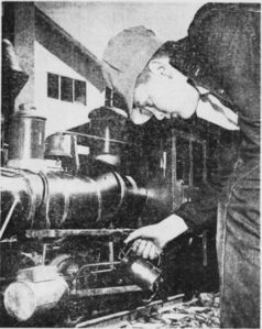 Engineer Sellar Nugent, 13, oils the valve gear of the 7-1/2 inch gauge "J.B. Adams" locomotive as it waits between trips on the Raccoon Gulch Lines in Fairfax.