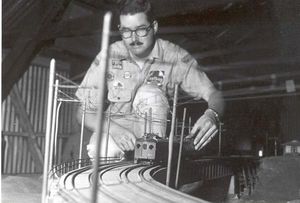 "Key Route" Ken Shattock aligning O gauge trolley cars, circa 1975.