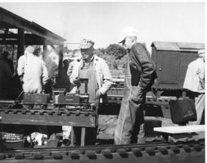 Carl Purinton - Founder of the IBLS in 1932-- checks over his small engine "GRANNY" at the old New England Live Steamers track in Danvers, MA. To Carl's right is his long time friend and pioneer Live Steamer, Harry Sait.