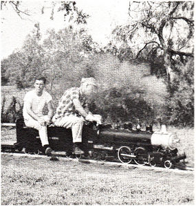 John Enders of Austin takes a train load of passengers around the main line at Falfurrias, Texas at the First Texas Live Steam Meet.