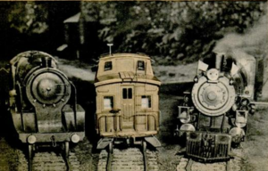 Left to right, English type engine, scale model caboose and an american live steamer. Track gauge of the system is 4-3/4 inches.