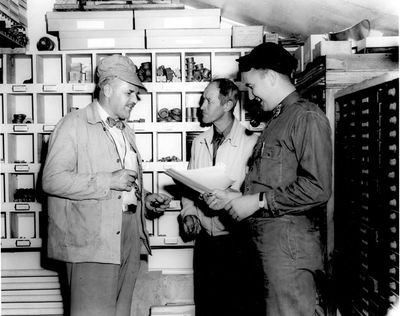 A casual conversation at Lester Friend's home shop in Danvers, Mass, 1949. Lester is on the left, Ray Peck in the center, and Lester's son Joe on the right. Photo by A.W.
