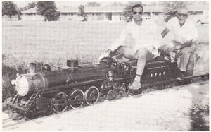 Joe Dale Morris, engineer, and L. L. Yates, passenger, enjoy a ride on Yate's 7.5 inch gauge Pacific at the Second Annual Texas Live Steam meet, Falfurrias, Texas, September 1970. Photo by Carol Dryden. From Live Steam Magazine, January 1971.